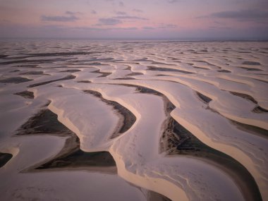 Beautiful view to white sand dunes and rainwater pools in Lenis Maranhenses, near Barreirinhas, Maranho, Brazil 