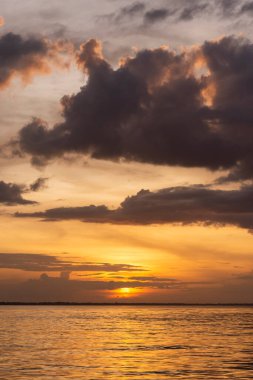 Beautiful view to orange sunset clouds and river in the Amazon Rainforest, near Manaus, Amazonas State, Brazil