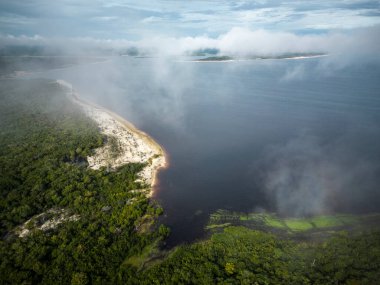 Beautiful aerial drone view to large rivers and green rainforest in the Brazilian Amazon