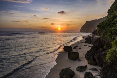 Sunset over the Beach of Melasti in South Bali in Indonesia