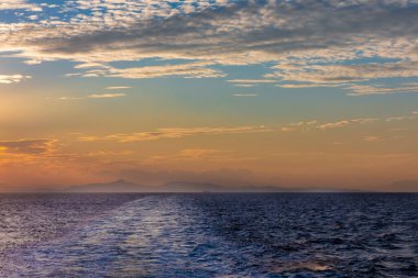 Sunset view from the ferry between Greek islands