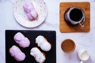 homemade eclairs with white vanilla glaze