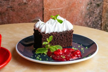 chocolate dessert with buttercream and coffee in a cup