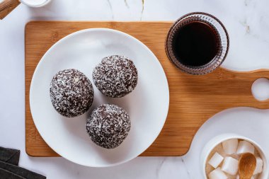 homemade round chocolate candies with coconut sprinkles