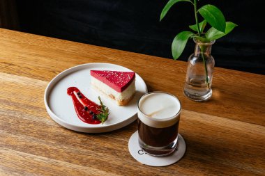 cheesecake and coffee on a wooden table in a coffee shop