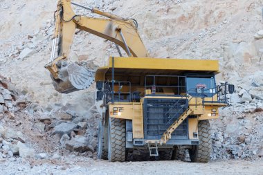 Mining machinery working in open pit mine