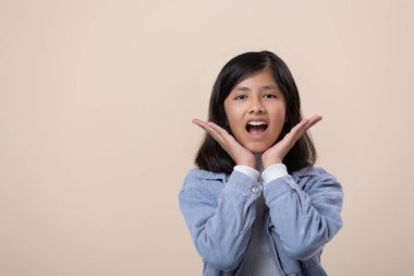 Mexican girl sitting surprised face
