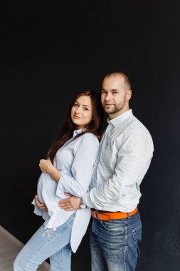 couple expecting a child is experiencing a happy period of pregnancy