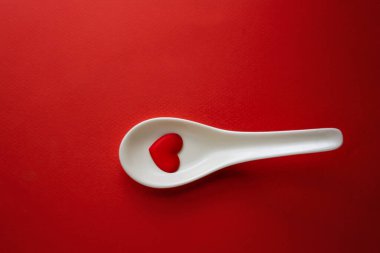 Red Heart shape in white spoon