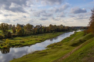 Autumn landscape Memele river with colorful trees