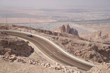 Family travels by car to enjoy the view from mountains to the desert.