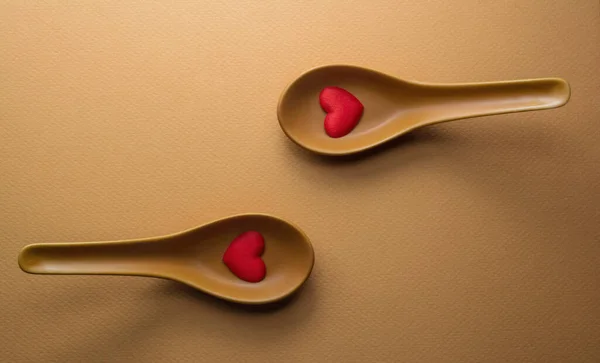 Top View Two Spoons Red Hearts — Stockfoto