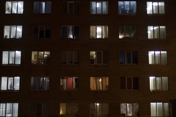 Windows in house at night. Light from windows of apartments.