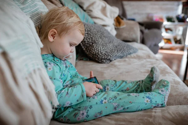 Toddler screen time on mobile phone in home