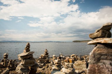 Towering cairns at the Burlington, Vermont Lake Champlain shoreline near Waterfront Park on Tuesday, October 9, 2018.