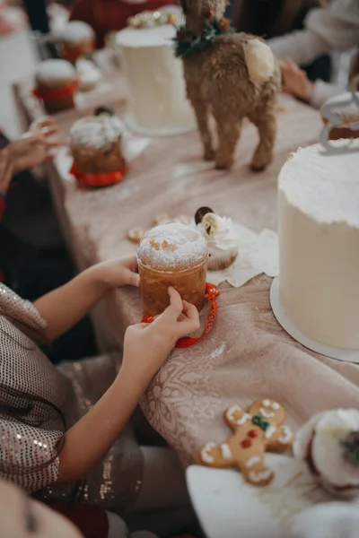 stock image Children sitting in the kitchen holding a cookie.