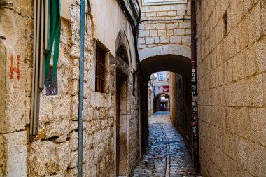Medieval slab alley with various arches