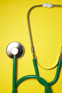 Stethoscope on a yellow table