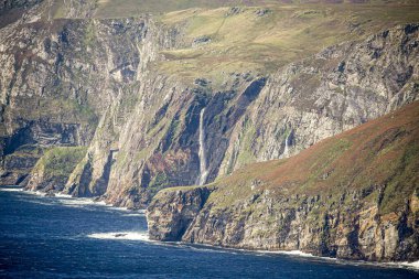 Waterfall on cliffs in Ireland