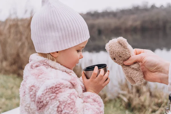 Baby Girl Drinking Tea Thermos River Late Autumn — Stock Photo, Image