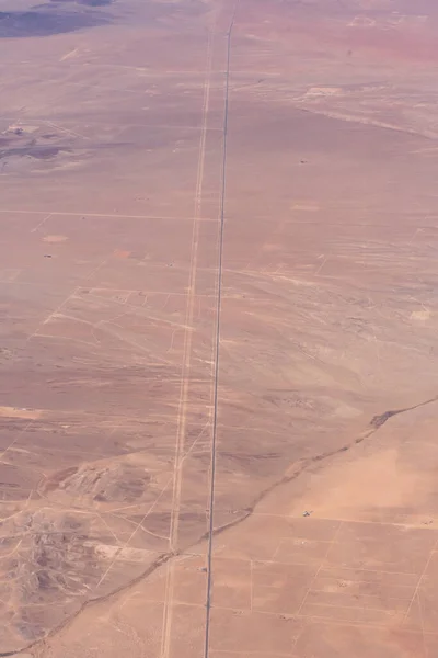 Aerial view of a desert road and land parcels