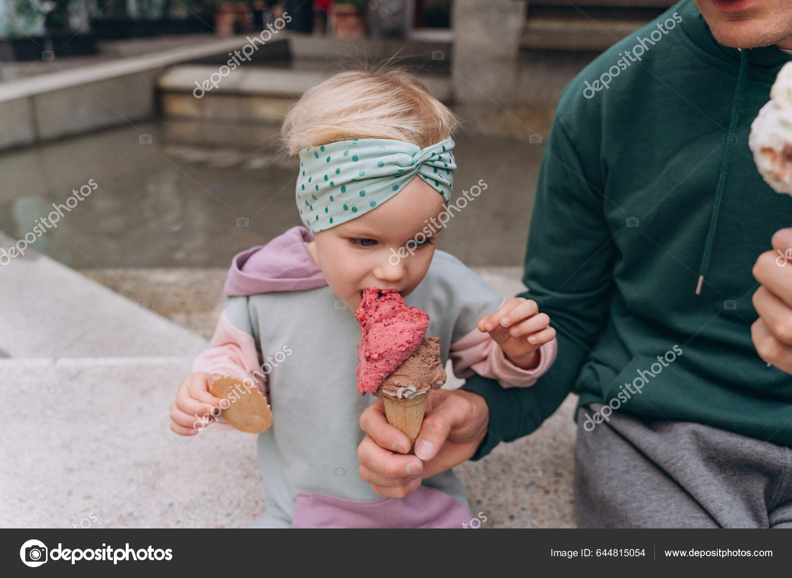 Dad Feeds Daughter Berry Ice Cream Waffle Cone Close — Stock Photo © Cavan  #644815054