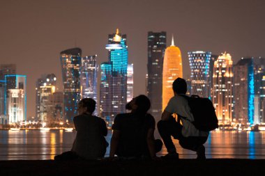 people looking the skyline doha views in qatar lights clipart