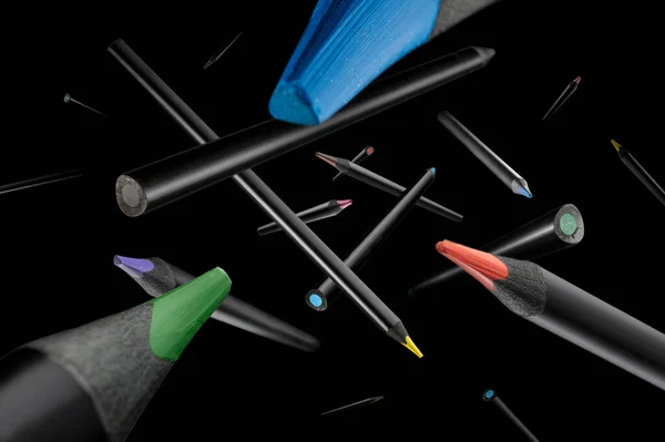 Colored pencils with a black base fly apart in a black space.