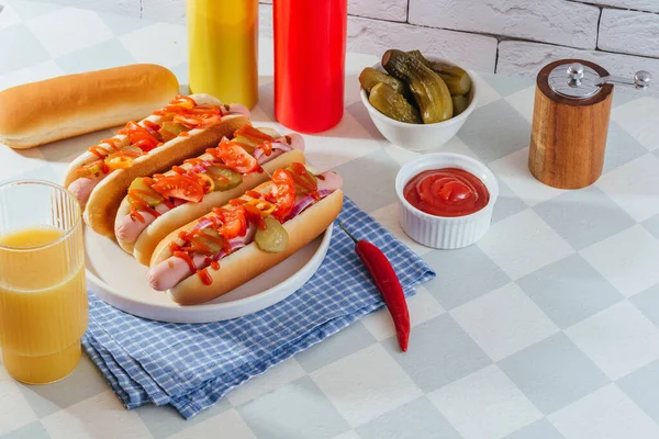 american hot dogs in a plate on a light table