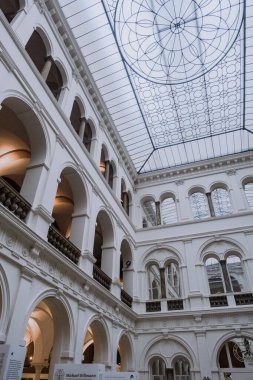 Wroclaw, Poland - December 29, 2017: Wroclaw national museum ,interior view of the white neoclassical atrium designer ceiling and arcade galleries inside the Wroclaw National Museum, Europe