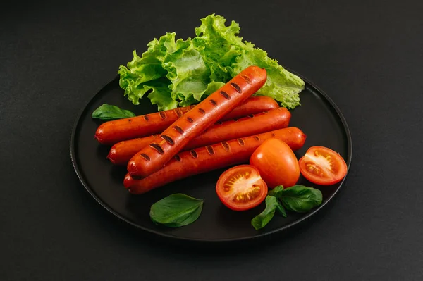 Grilled Sausages Black Plate Vegetables Sauce — Stock Photo, Image