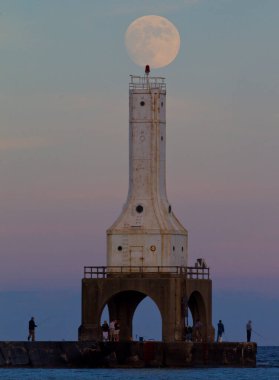 Full Moon atop lighthouse in Wisconsin. clipart