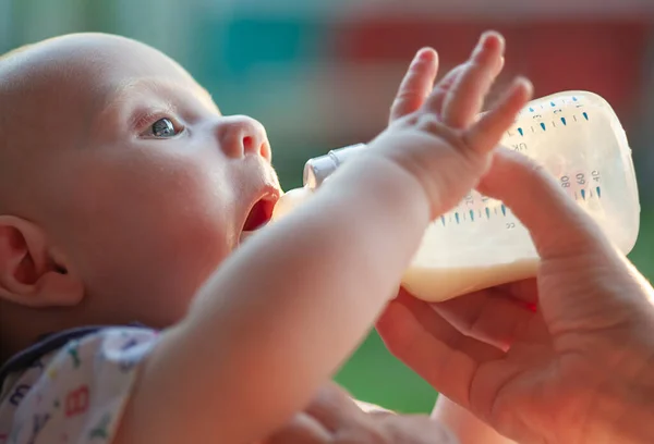 Small Child Drinks Milk Bottle — Stock Photo, Image