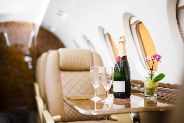 champagne on board a private jet