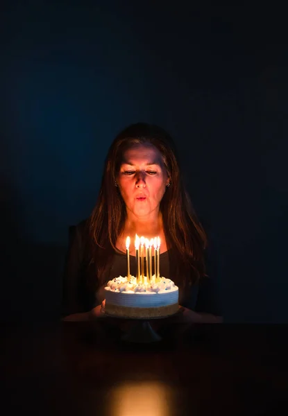 Attractive Woman Blowing Out Candles Birthday Cake Dark Room — Stock Photo, Image