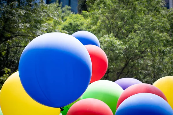 colored big balloons in the pride parade in Mexico city.