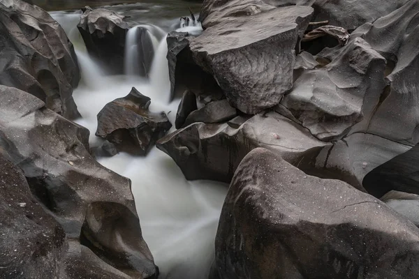 River cutting through smooth Brazilian rock formation