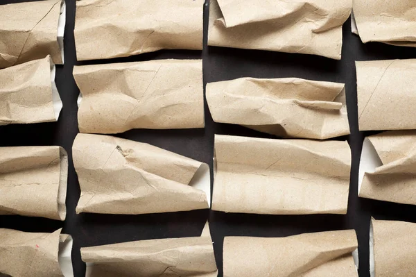 stock image Empty toilet paper rolls on a black table