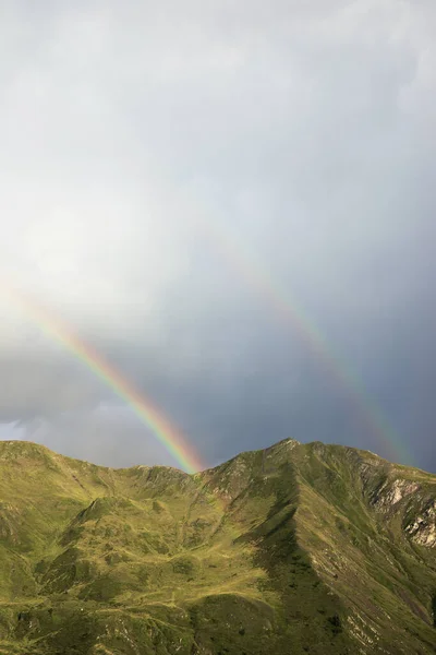 Rainbow during a storm in the Pyrenees.