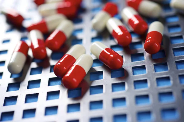 Red White Pills Metal Grid — Stock Photo, Image