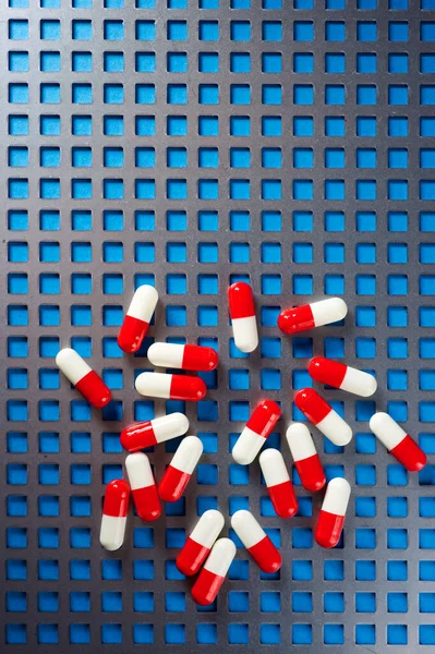Red White Pills Metal Grid — Stock Photo, Image