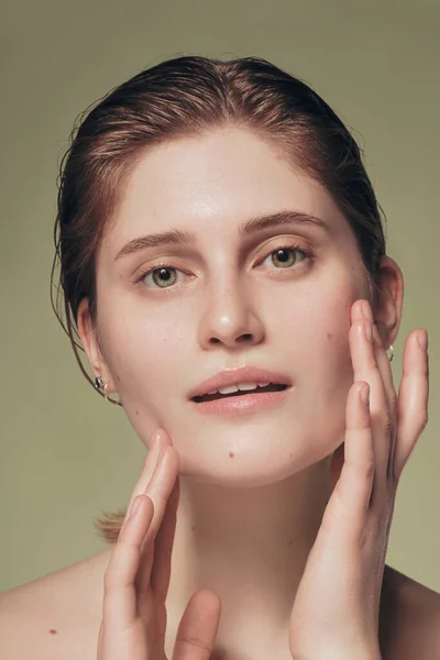 stock image Close up model with hydrated facial skin and natural makeup on green