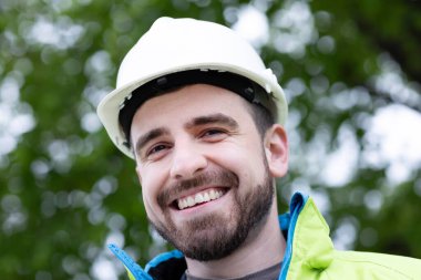 portraitof a enginner with helmet and beard clipart