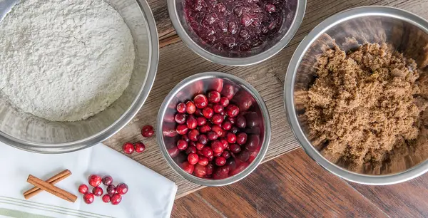 Baking Ingredients Stainless Bowls Cranberries Cinnamon — Stock Photo, Image