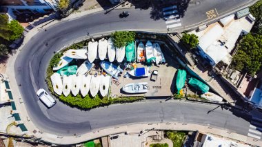 Aerial View of Boats Stowed on Curved Road in Urban Capri, Italy  clipart