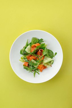 salad with salmon, vegetables and sauce