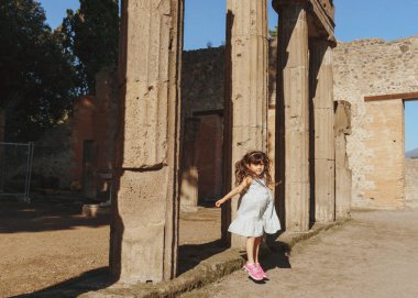 girl in the Roman archaeological site of Pompeii clipart