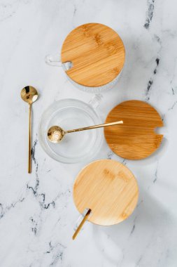 Bird's eye view of tabletop with bowls and spoons clipart