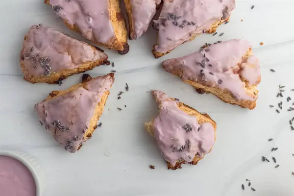 stock image Lavender glazed scones, a sweet crumbly delight