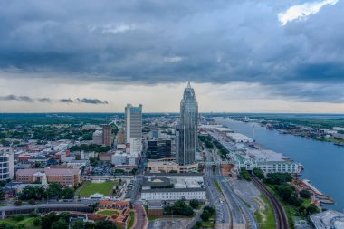 Downtown Mobile skyline at sunset in July clipart